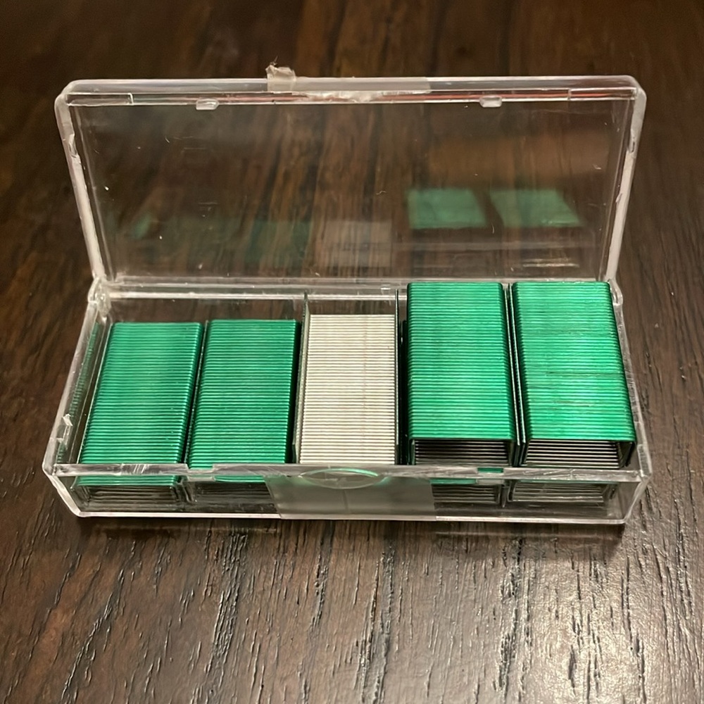 EUC (as in not a full case) Green standard office staples for a small stapler